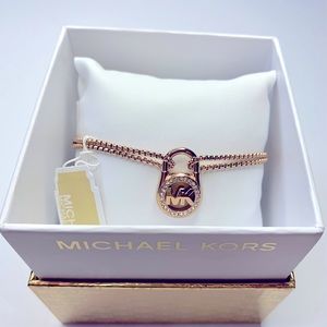Michael KORS Slider Bracelet - Padlock Crystal Halo Surrounds MK Logo Gold Tone